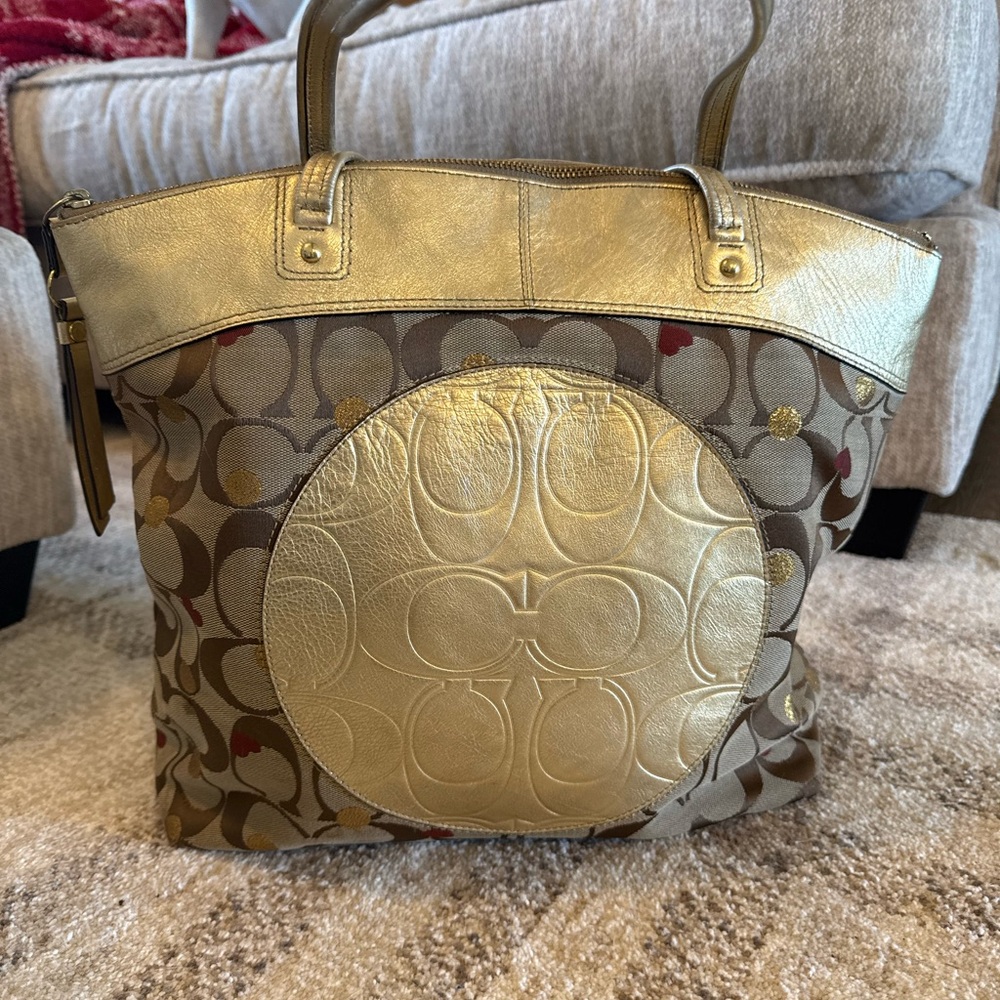 Coach carryall/tote!! Gold and tan signature C’s with hearts.